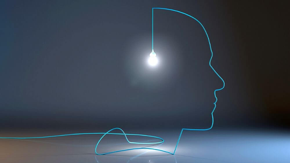 Blue Data Cable Making Outline of Face with Lightbulb