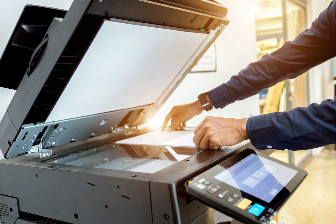 Business man hand press button on panel of printer printer scanner laser office copy machine